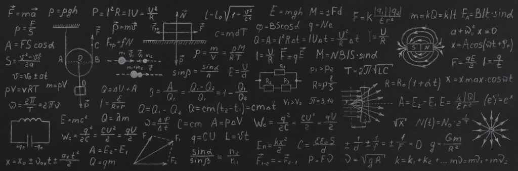 Formulas and calculations from mathematics and geometry on school blackboard