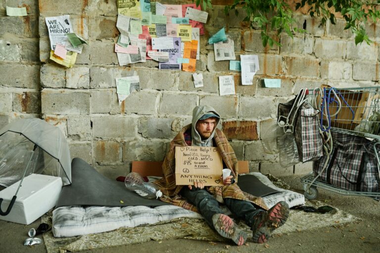 Homeless man begging on the street