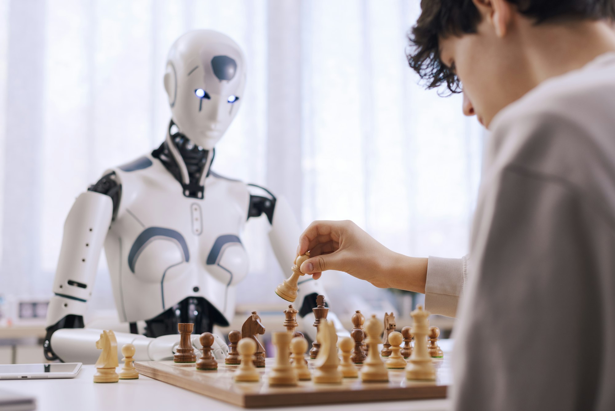 Intense competition: boy vs. robot chess match