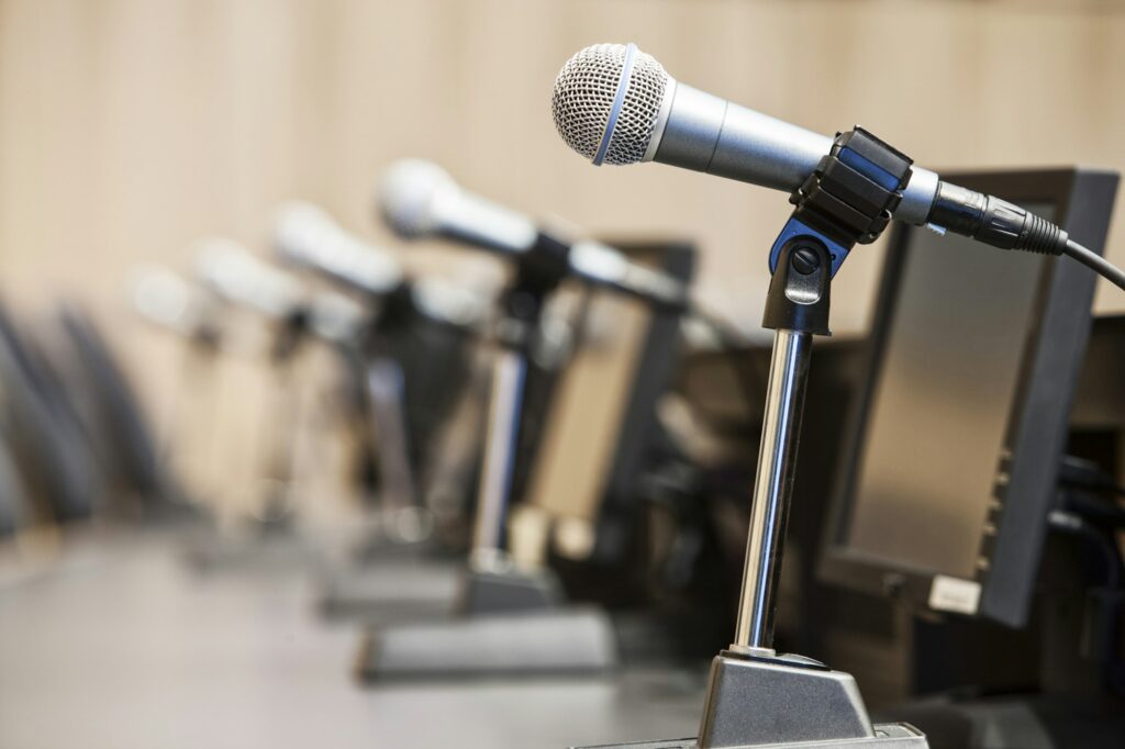 Microphones at a political meeing in city hall.