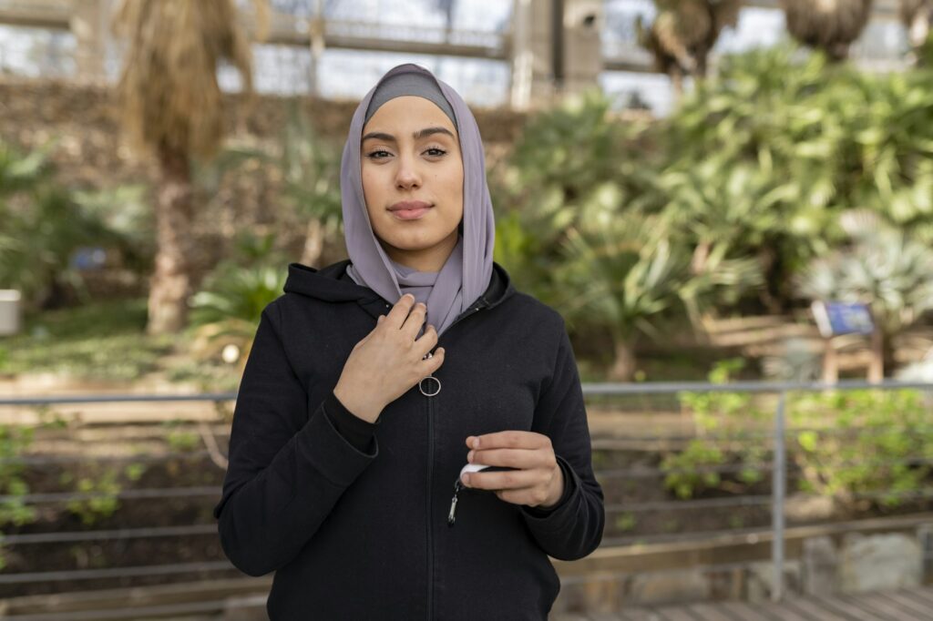 portrait of young muslim woman with veil looking at camera posing