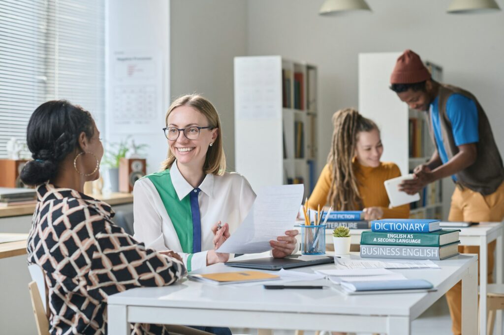 Teacher speaking English with student