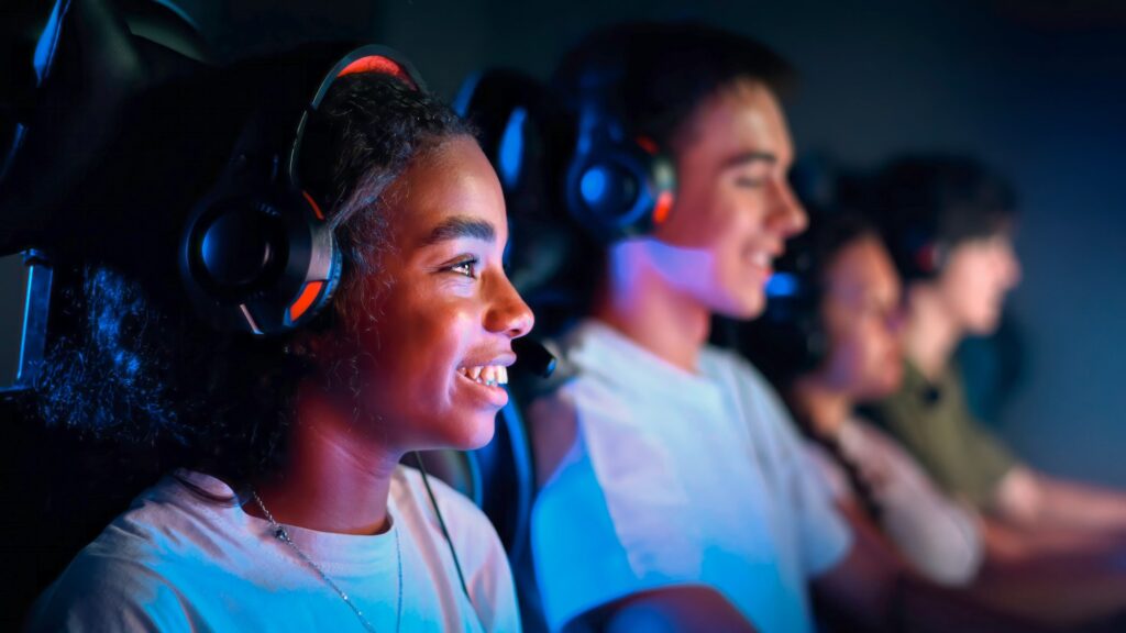 Teens playing in video game club