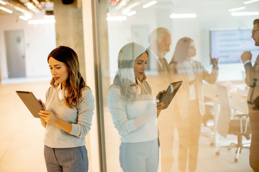 Young woman with digital tablet in the office