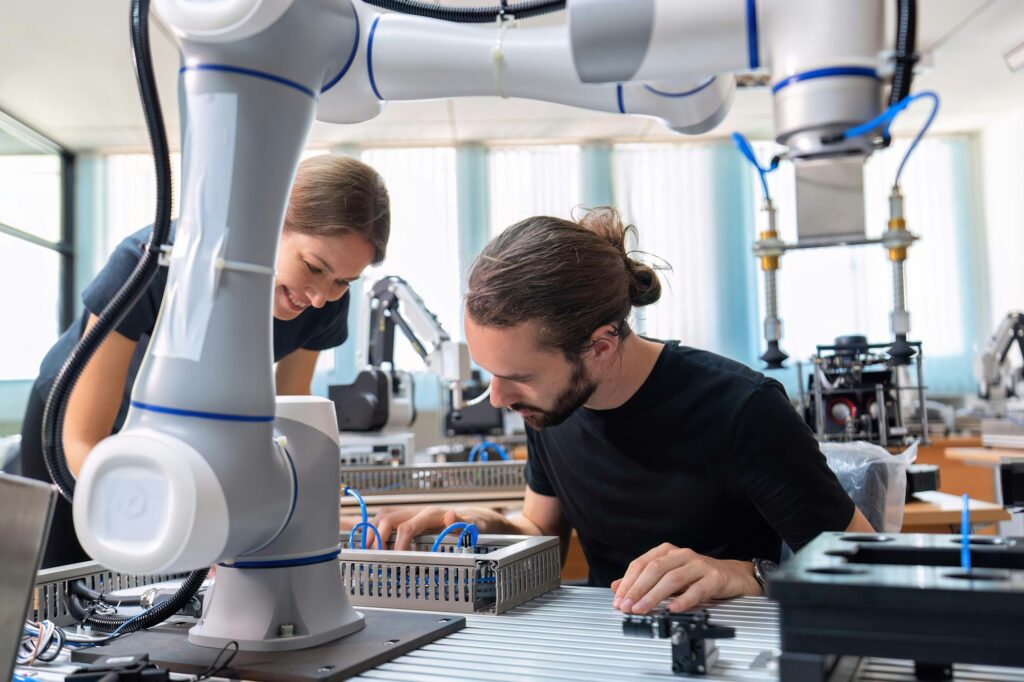 An engineer in research development robotic factory checking prototype of automation robot arm