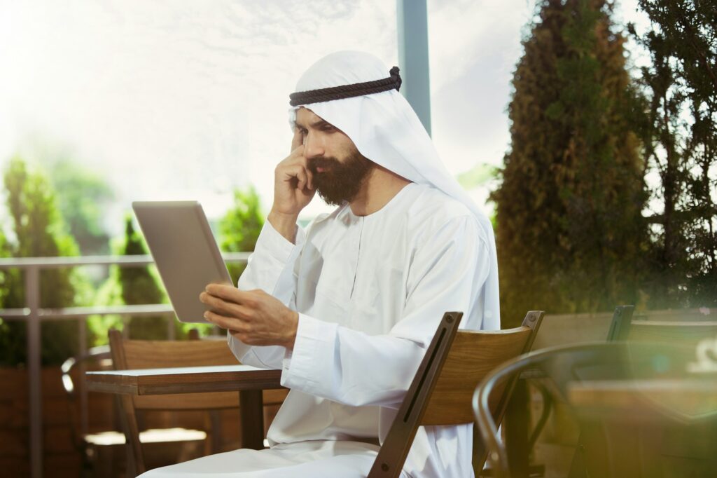 Arabian saudi businessman working outdoors