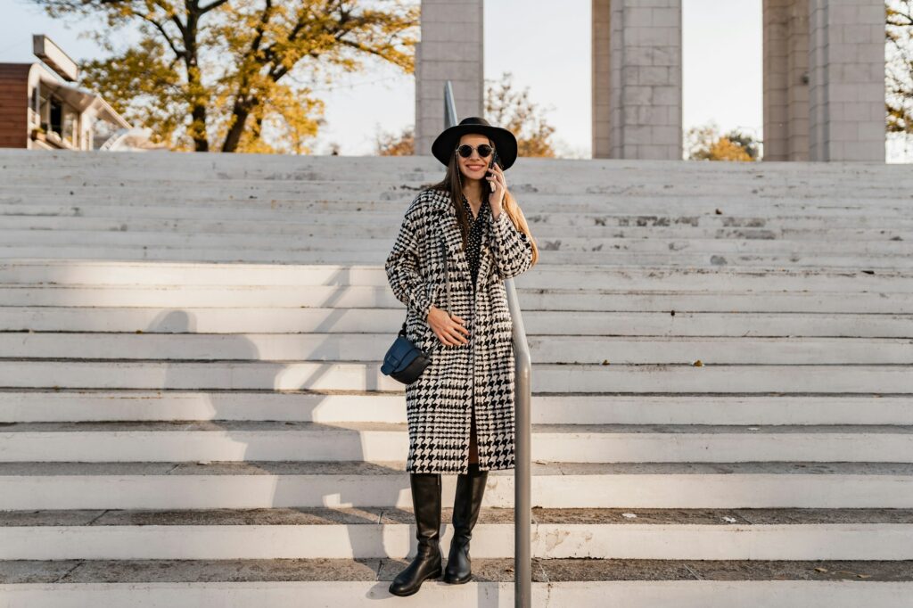 attractive young woman walking in autumn wearing coat