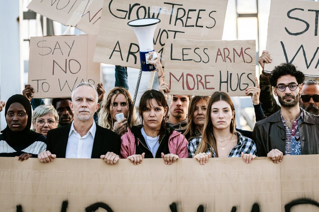 Big organized group of diverse people demonstrating in favor of world peace.