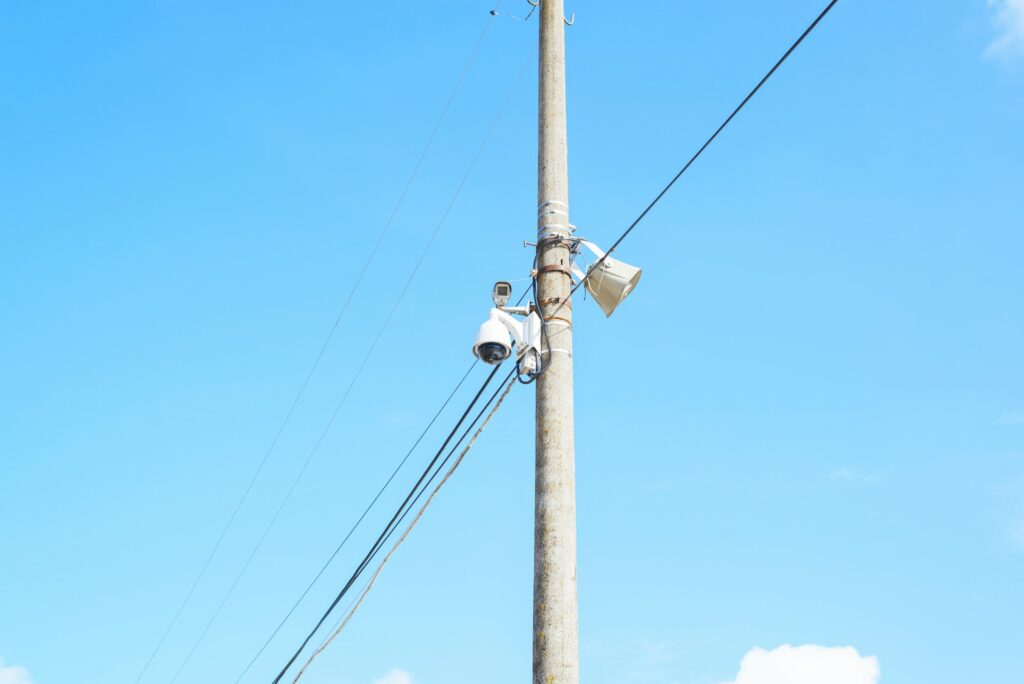 Group of surveillance cameras on pole in the city. Surveillance of citizens, face recognition system