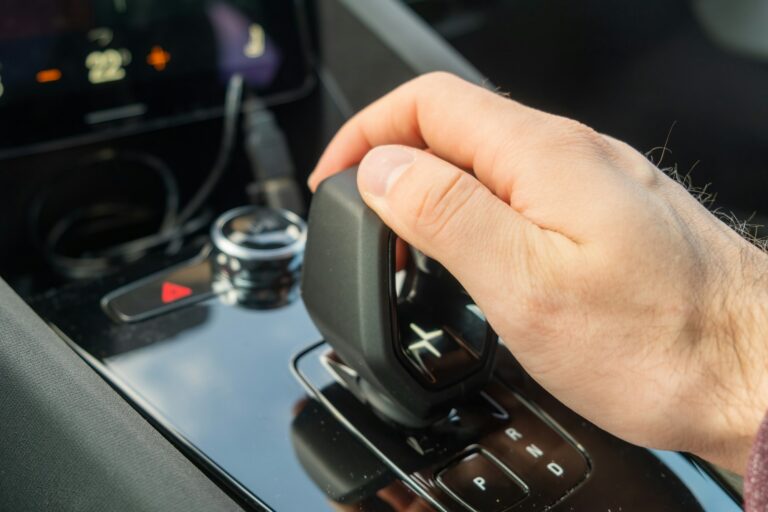 Man shifts mode on automatic transmission of new Polestar 2