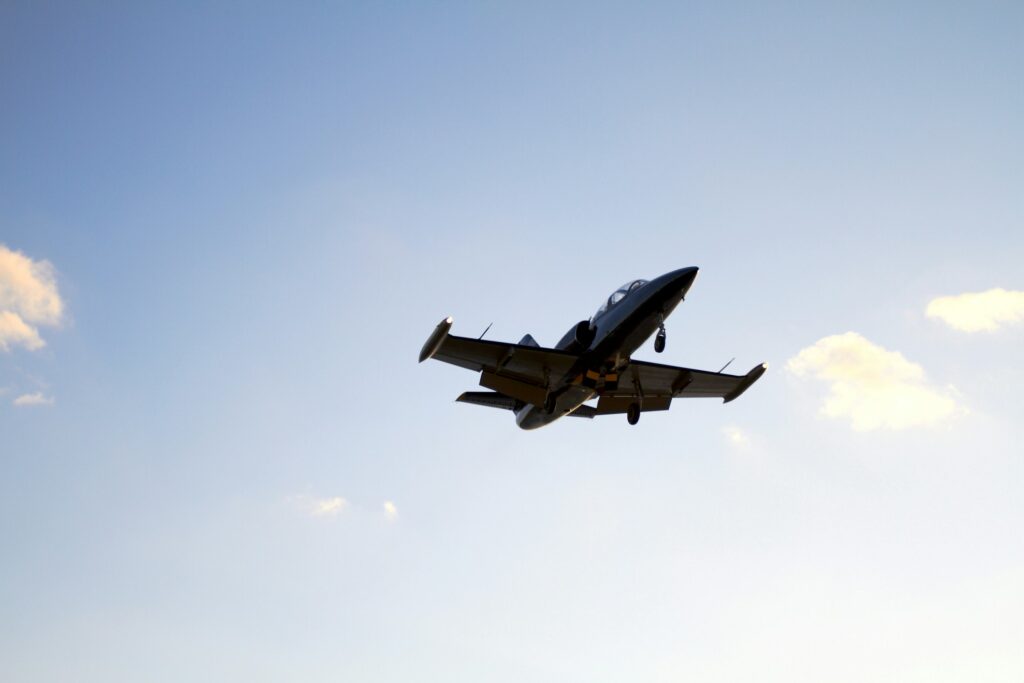 Private Aircraft landing on a blue sky background