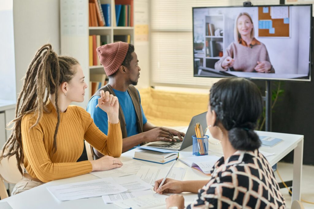 Students learning English with native speaker