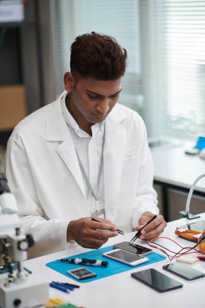 Technician Repairing Smartphone