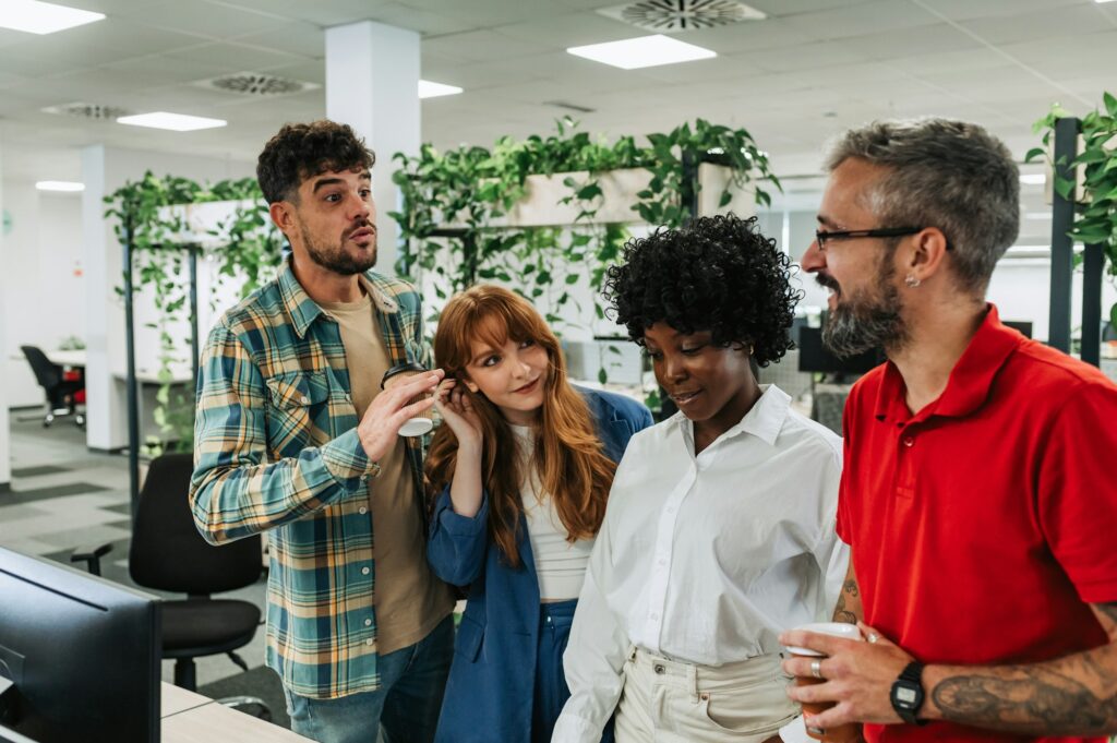 An interracial team is discussing global market at the office.