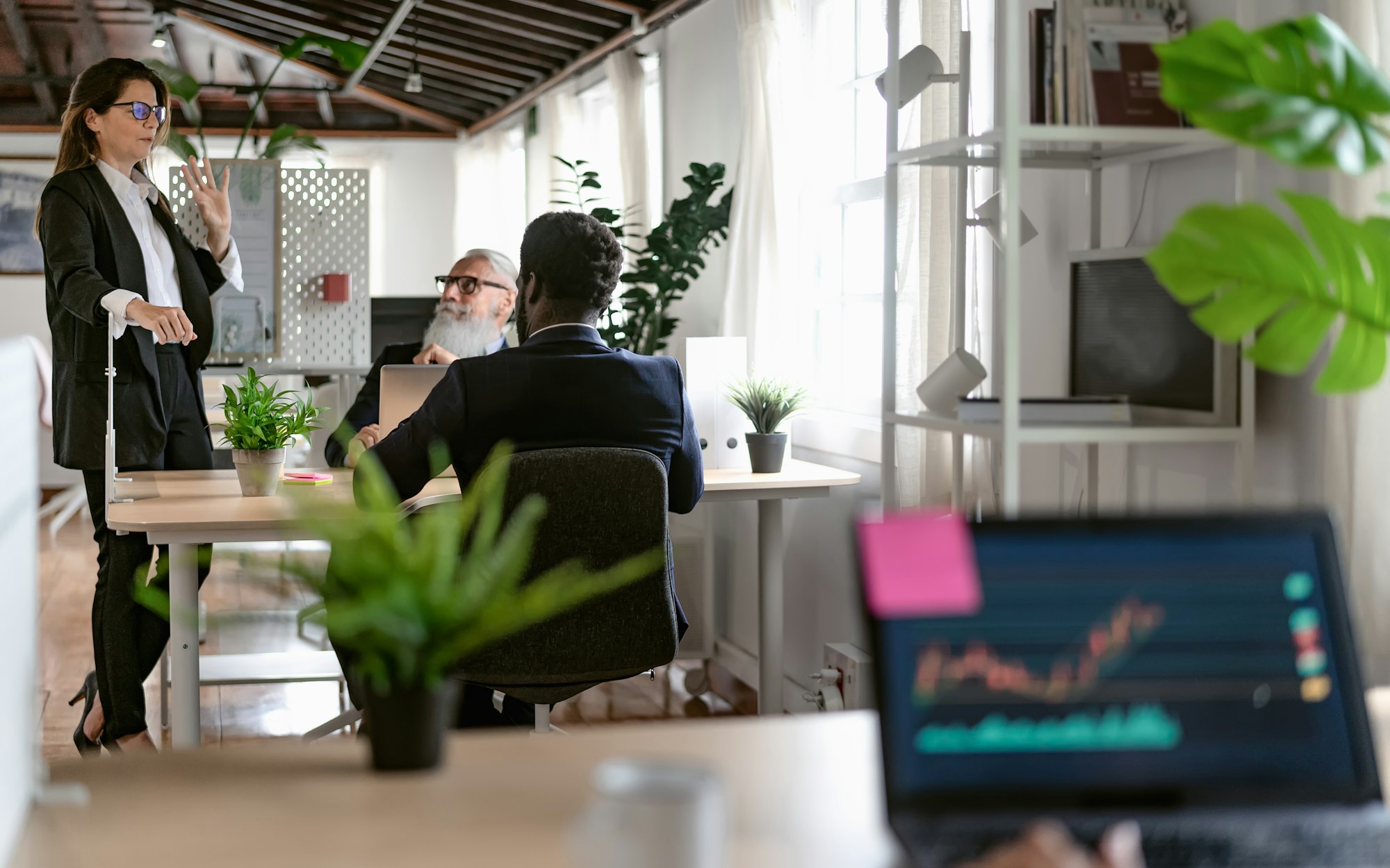 Business people discussing over new investment project inside office - Entrepreneurship concept