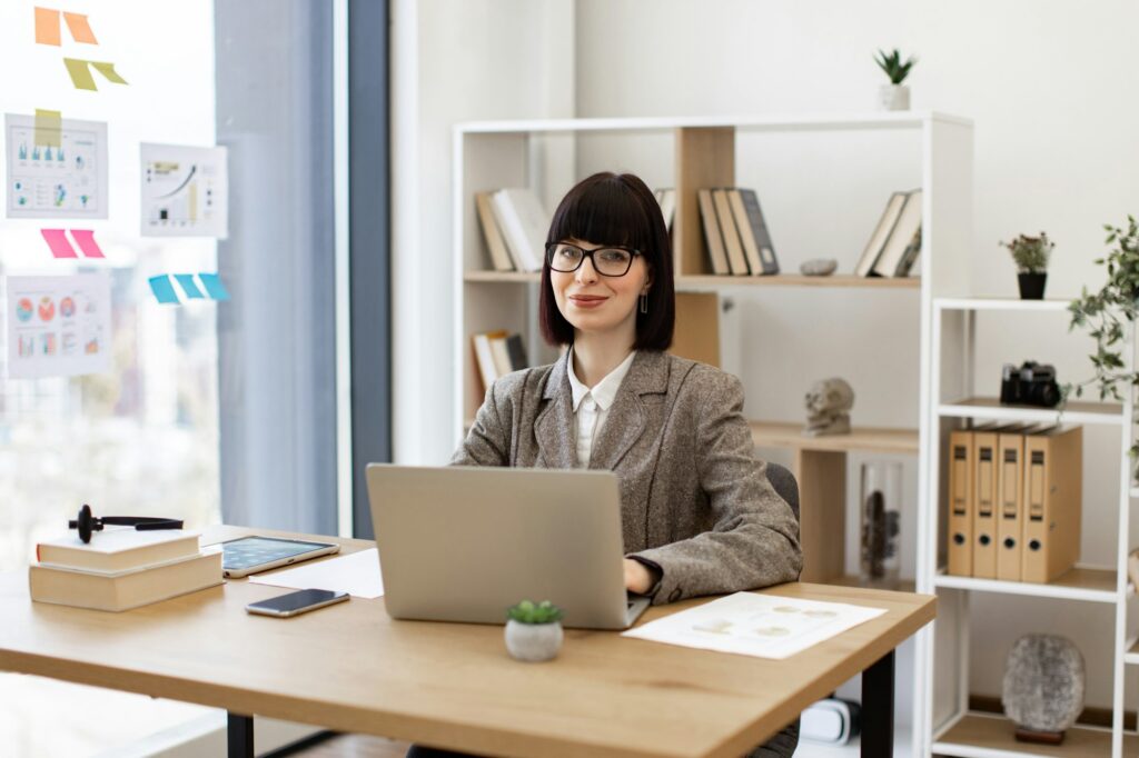 Caucasian female worker investigating trademarks using search engine.