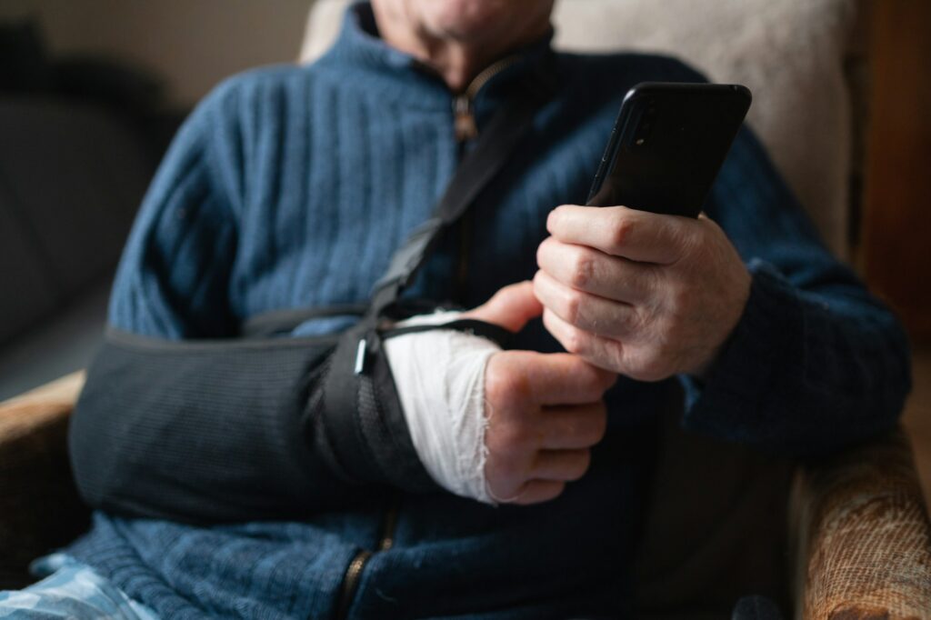 Close-Up of Senior Man with Arm Sling