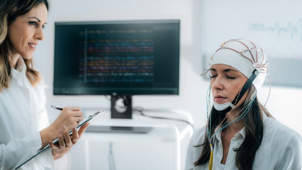 Doctor and Patient in Neuroscience Lab, Doing EEG Scan