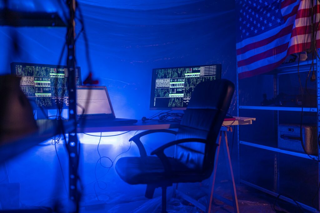 Internet hacker workplace in dark office, cyberwar concept.