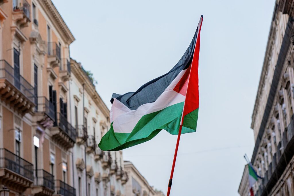 Palestinian Flag Waving in the City - Symbol of Freedom and Solidarity