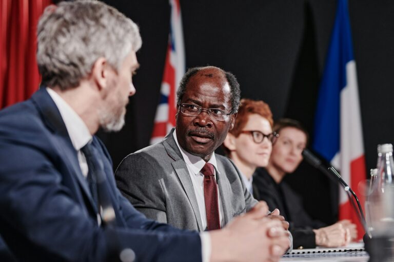 Political colleagues discussing at meeting