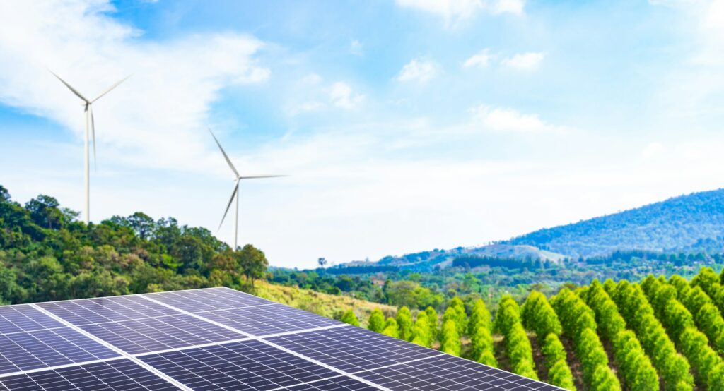 Solar Panel Energy Photovoltaic Roof with blur Plant Growth Tree and Wind Mill