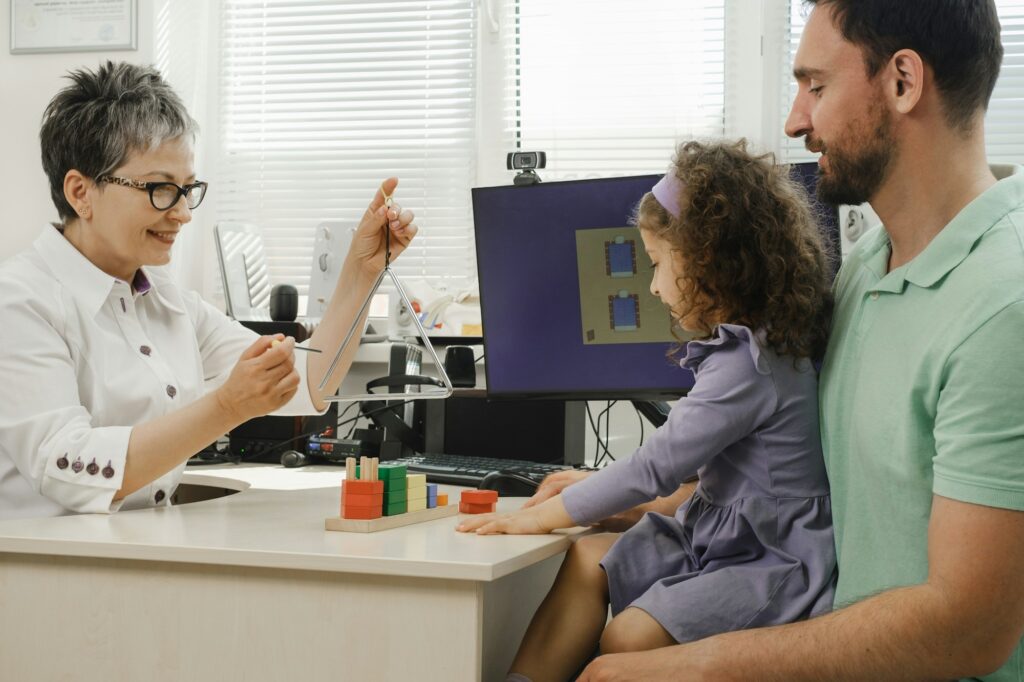 speech therapist working with child who has hearing problems