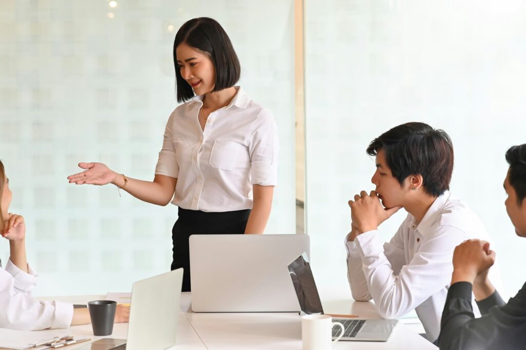 Young Businesswoman present in meeting room.