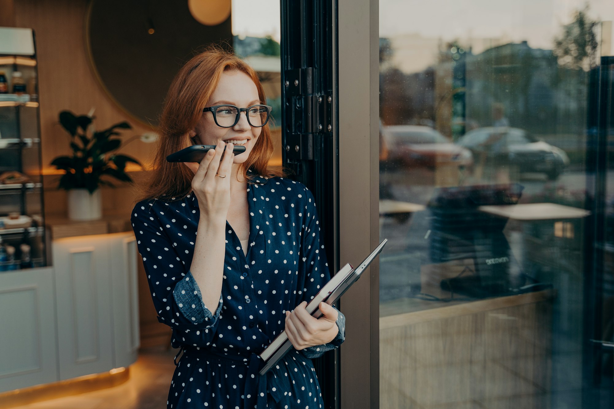 Young woman makes voice call uses modern technologies for communication