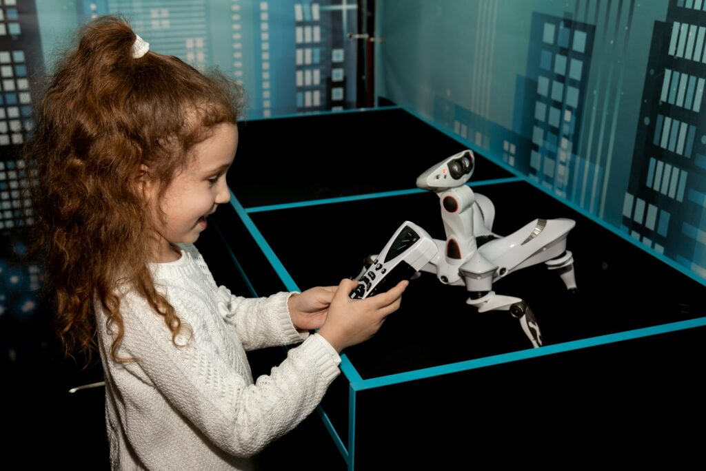 A girl at a robot show. Technology. Future.