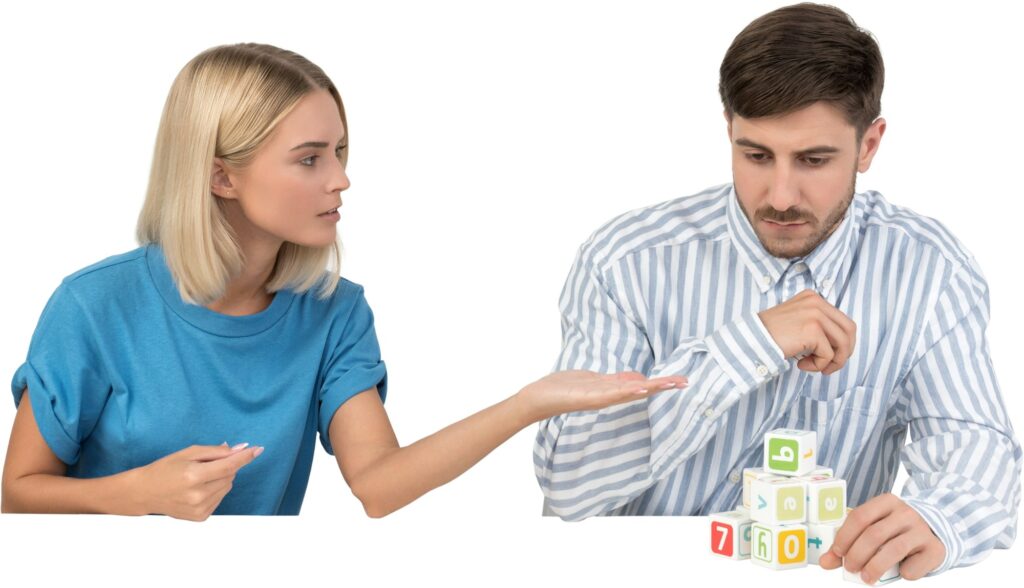 a man and a woman playing with blocks