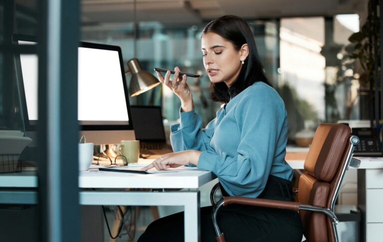 Phone call, woman and computer in office at night with screen, space and mockup, speaker phone and