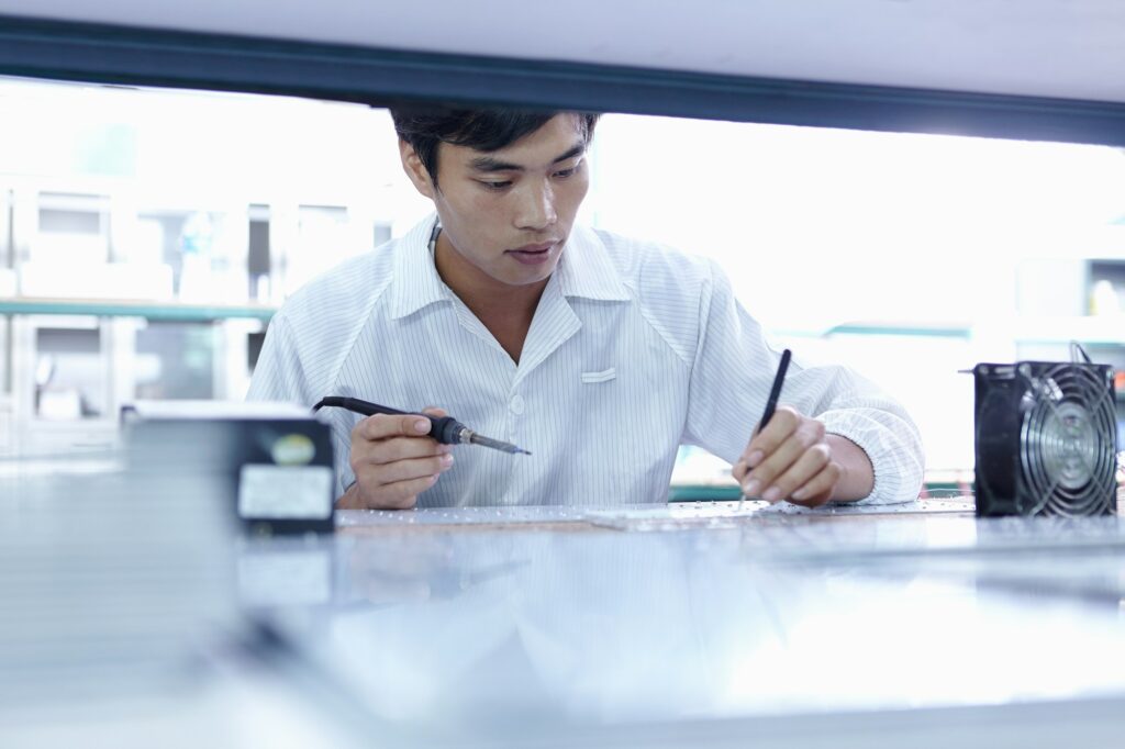 Technician working in LED factory