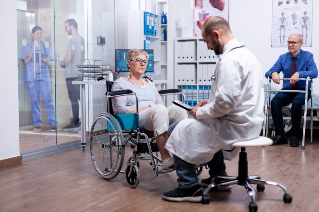 Woman with parkinson sitting in wheelchair