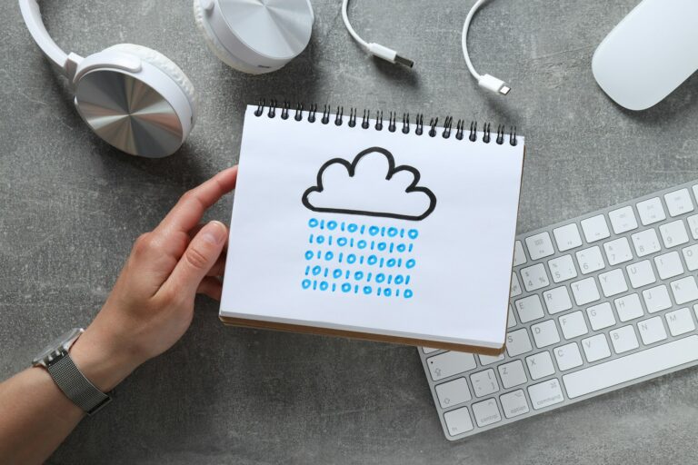 A notebook with a drawn cloud on a gray background