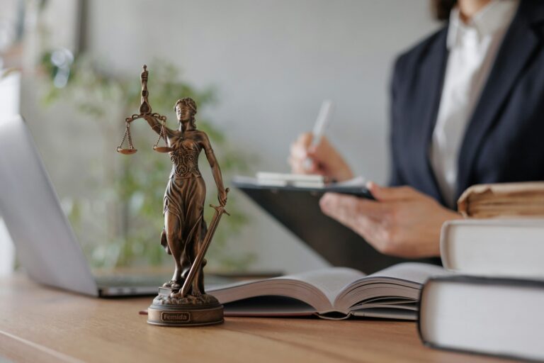 a statuette of the goddess of justice. a symbol of honesty and decency. legal services and assistanc