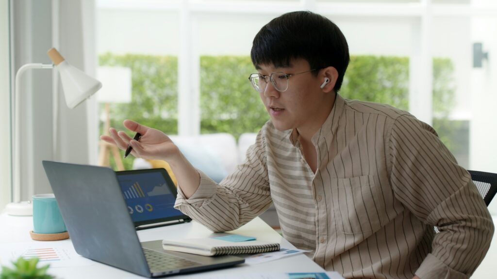 Asia people glasses chinese male busy talk discuss on desk at home