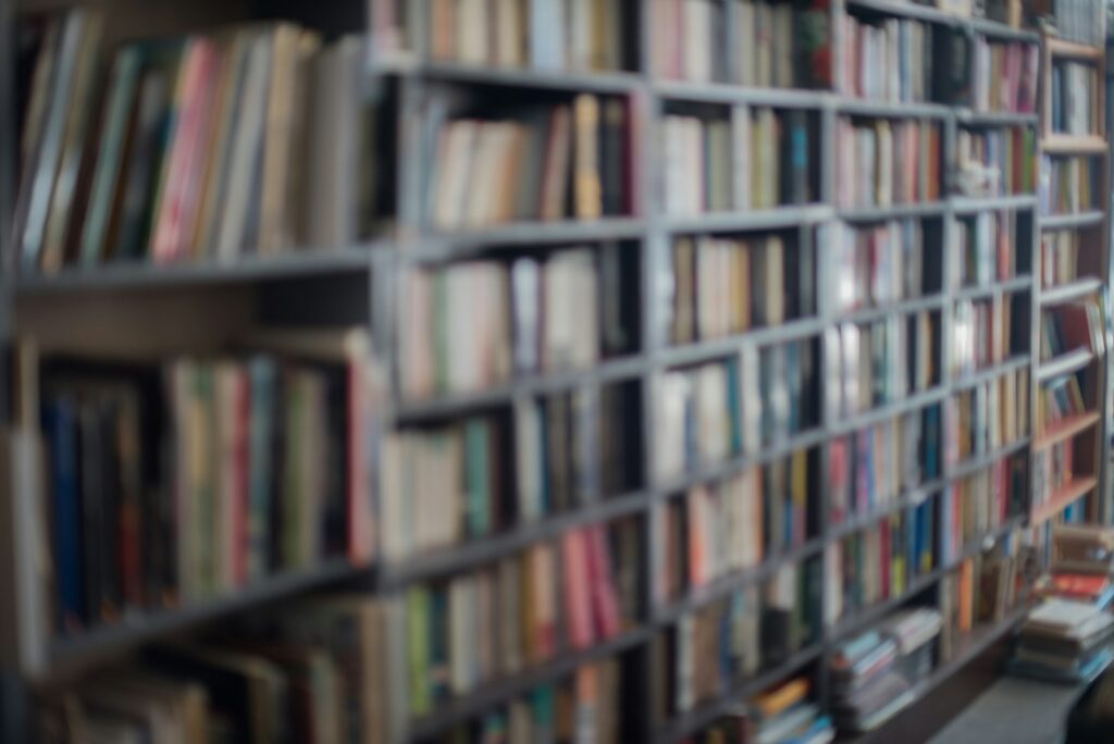 Defocused background of books on rack in library