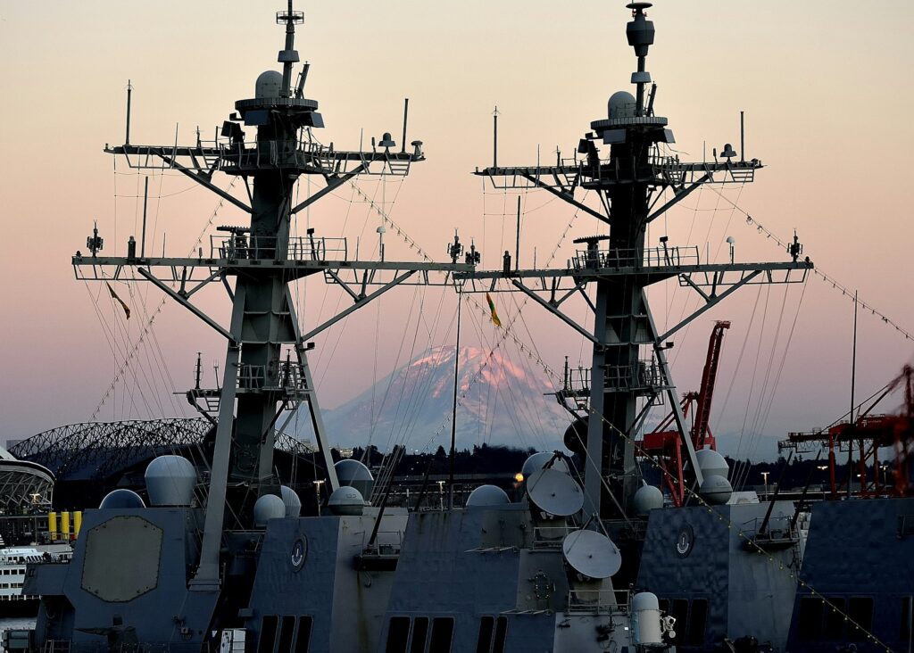 Dual warships framing Mount Rainier