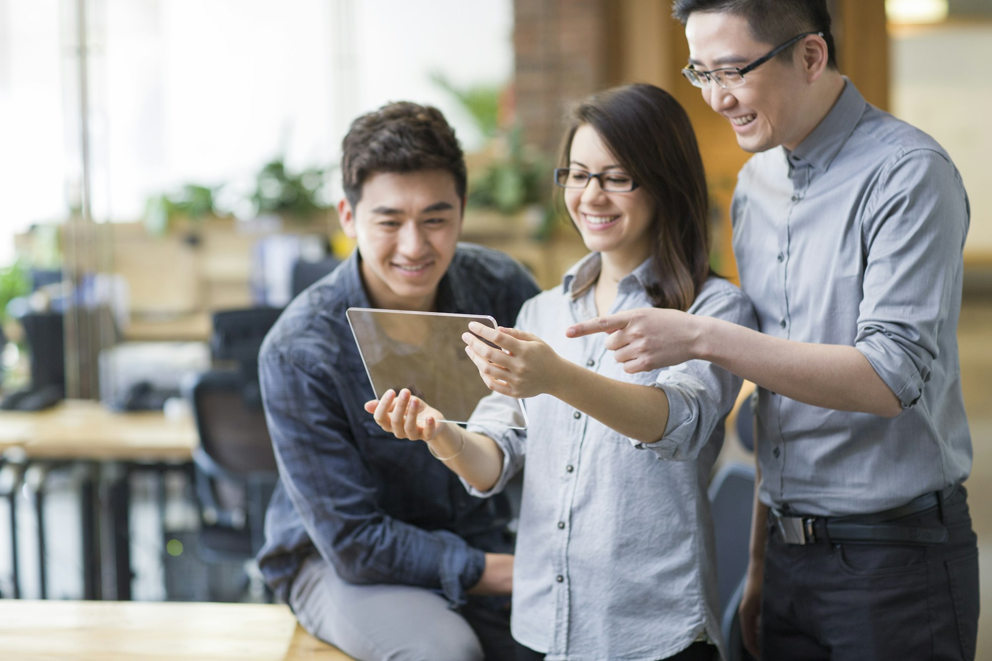 IT workers developing digital tablet