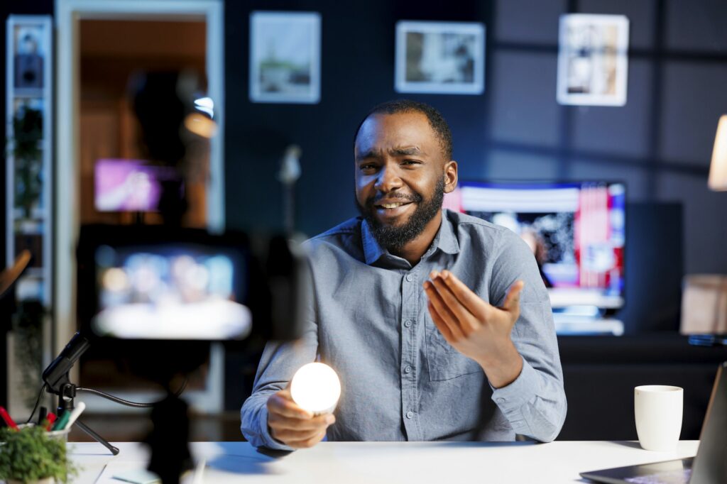 Man showcasing intelligent light bulb