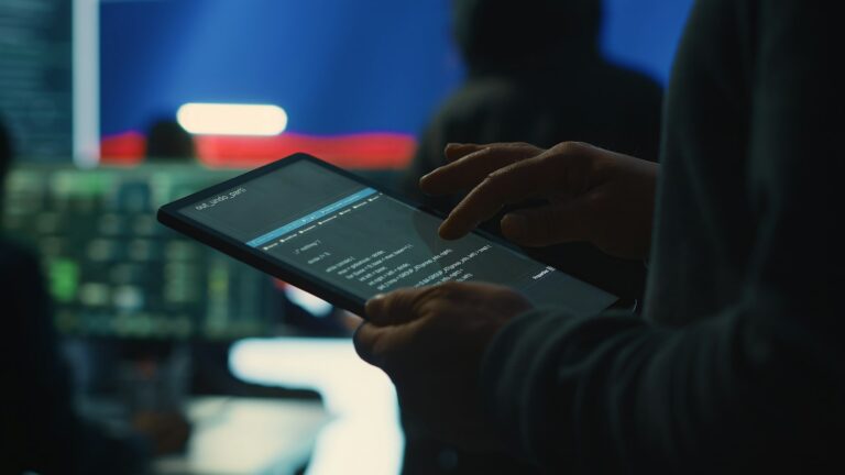 Person uses tablet in governmental cyber security room working for Russian flag