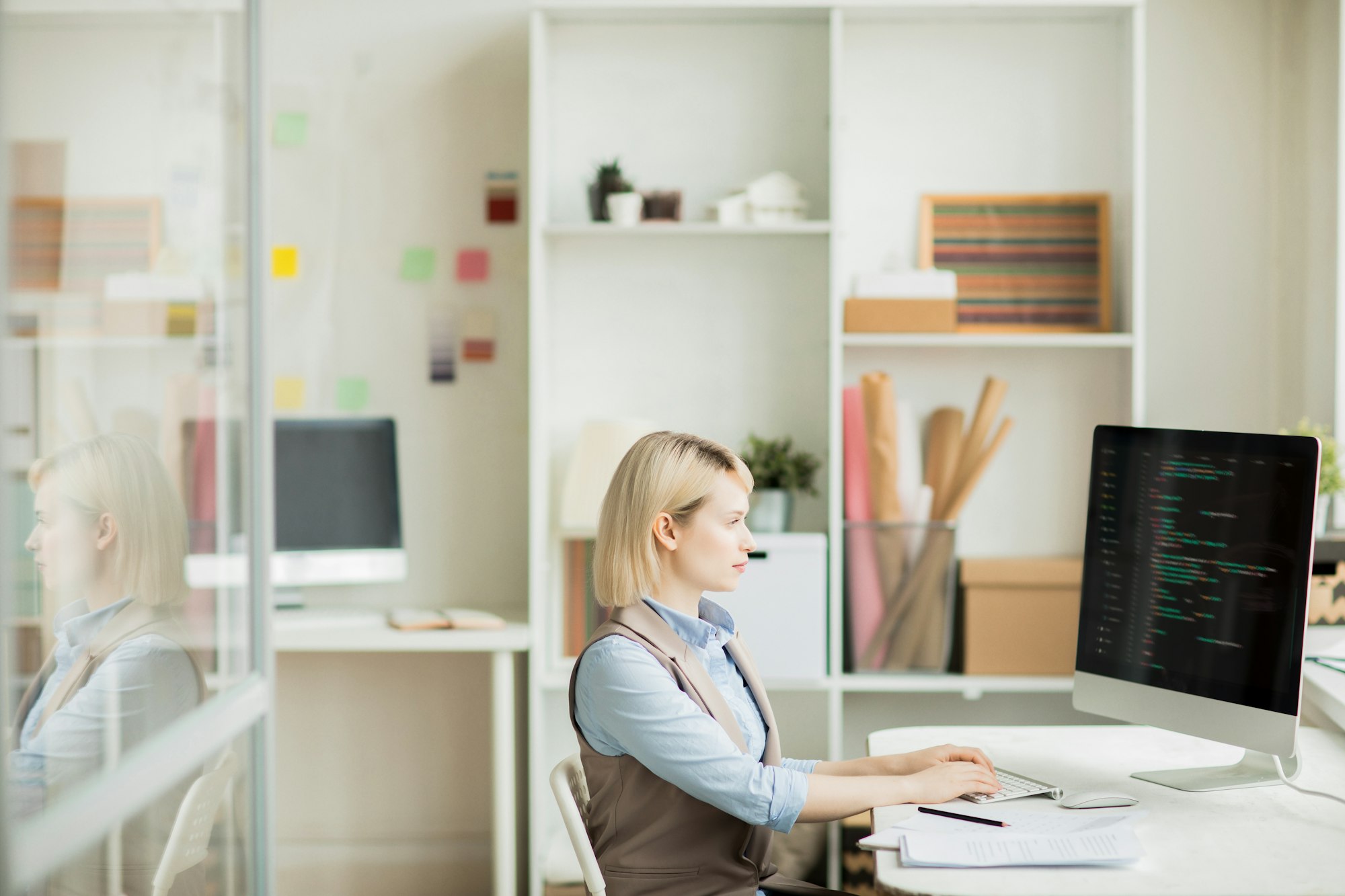 Serious lady working with computer language