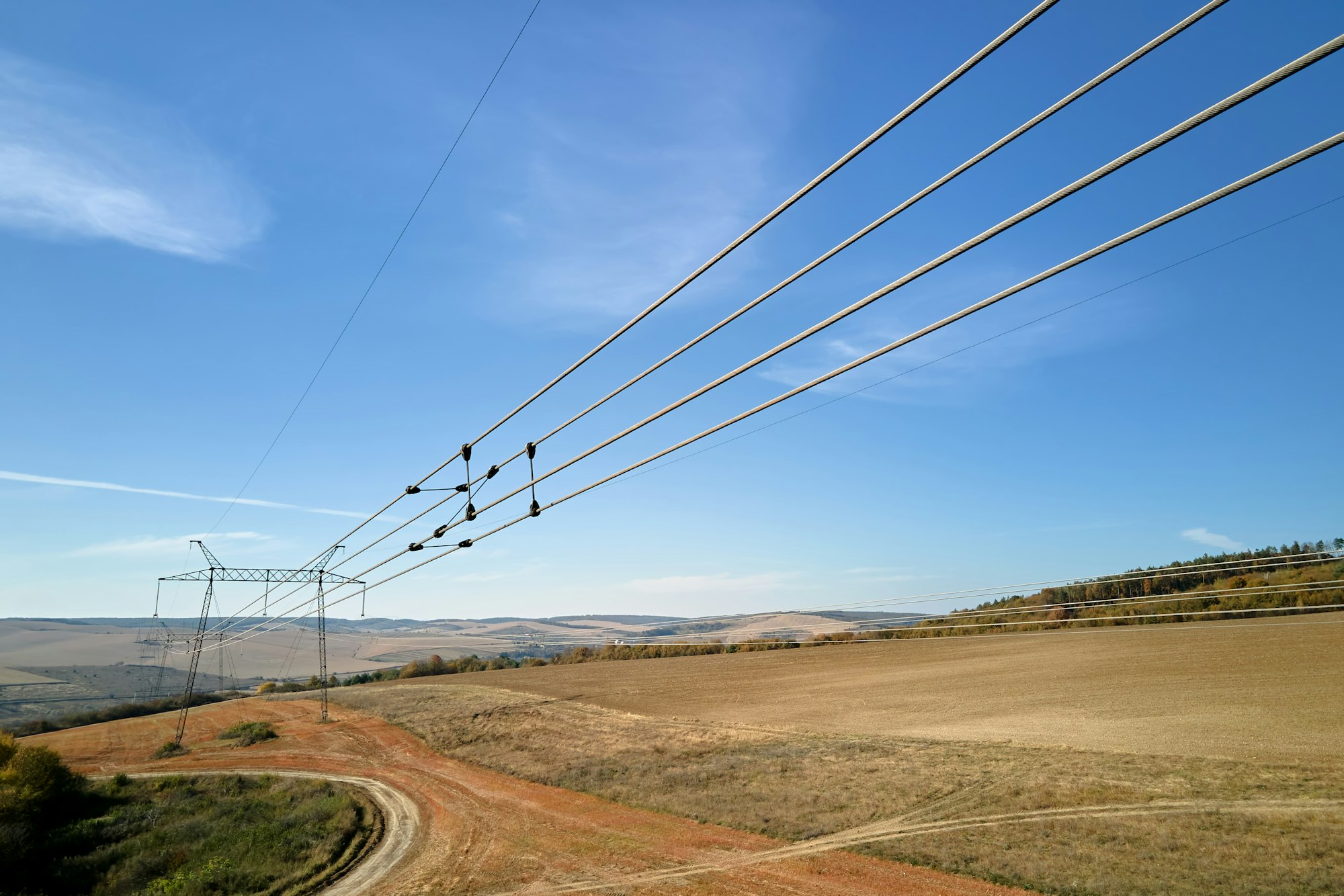 Steel pillar with high voltage electric power lines delivering electrical energy