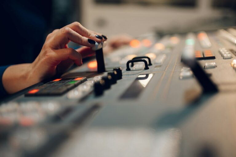 Woman hands using equipment in control room on a tv station