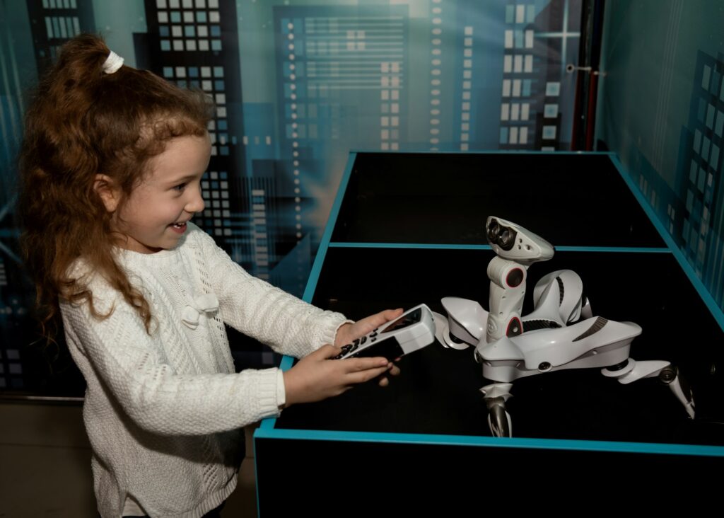 A girl at a robot show. Technology. Future.