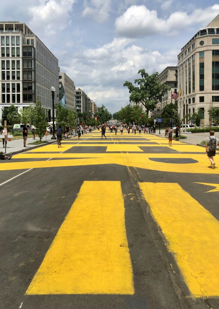 Black lives matter painted onto street my Washington DC mayor leading to White House