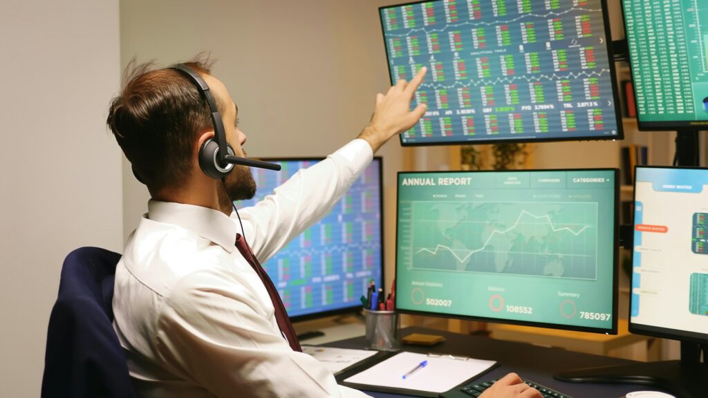 Businessman looking at stock market graphs