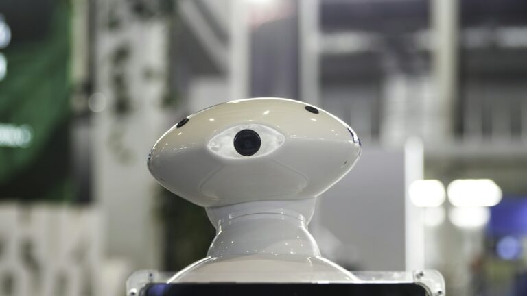 Close up of the moving humanoid robot with a camera on his head. Media. New technological robot