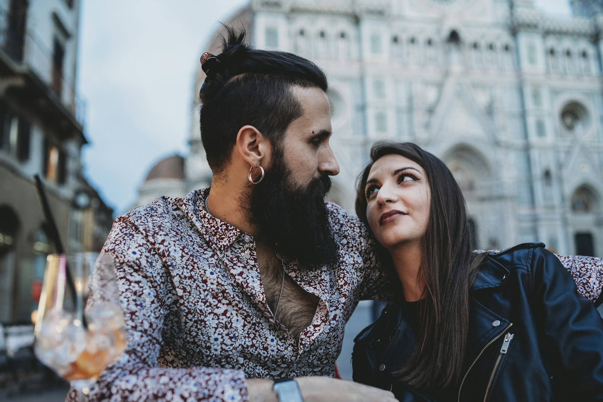 Couple enjoying an intimate moment in a city setting